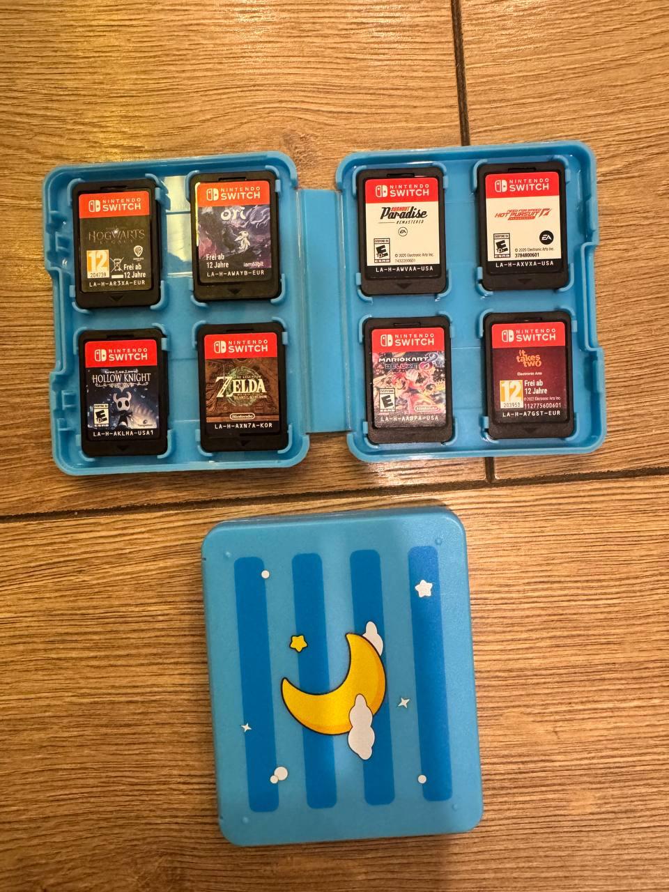Продам Nintendo Switch + кейс + комплект игр